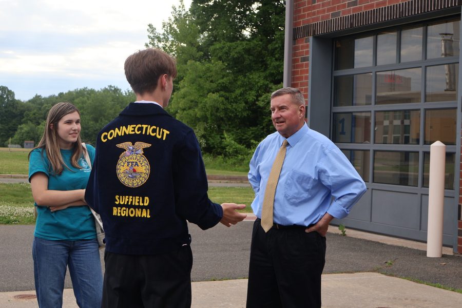 Senator Kissel speaking with a student from a Connecticut technical high school