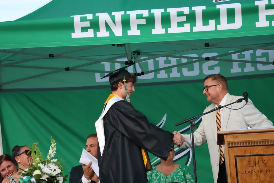 Senator Kissel congratulating a graduate at an Enfield High School commencement