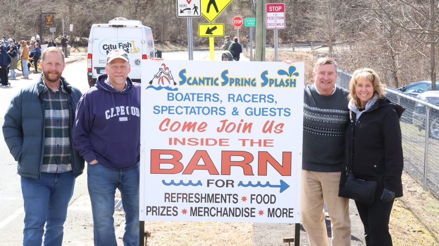 Senator Kissel with residents in front of a community fundraiser sign